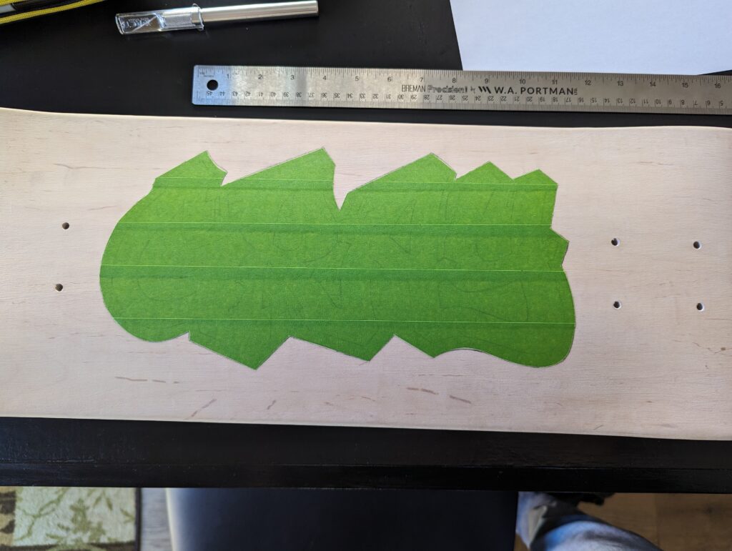 first layer of masking tape applied to the board